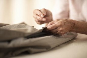 Reattaching buttons is a common mending job.