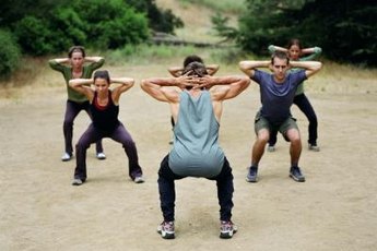 The squat is a compound hamstring exercise that also engages your glutes and quads.