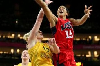 Candace Parker, in Team USA's red uniform, drives against Australia.