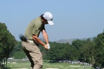 Rory McIlroy keeps his right elbow near his hip midway through the downswing.