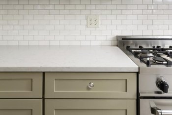 kitchen backsplash tile outlet plugs ceramic counter burn laminate covers put marks around repairing cabinet remodeling without cut its doityourself