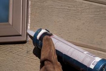 how to remove smeared silicone caulk on exterior of house