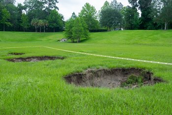 How to Repair Sinkholes in the Backyard