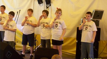 Kids sign a song at a summer camp