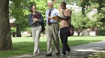 professor speaking with two of his students outside of class