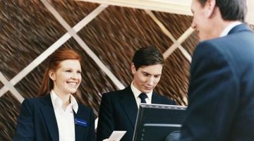 Woman working at hotel front desk