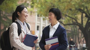 P.H.D candidate asking an advisor something while on campus.