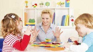 preschool teacher talking to students