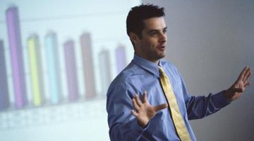 Professor giving business lecture in front of projected graph
