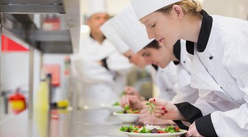 Row of culinary students finishing off their salads