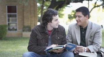 Student speaking with professor on campus.