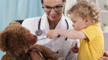 A young boy is having fun at the nurses office.