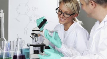 Biochemistry student working in laboratory with professor.