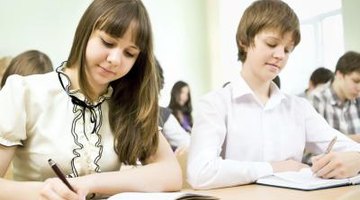 Students writing in notebooks.