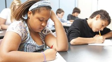 High school students taking test in classroom