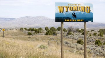 A welcome to Wyoming sign at the state border.