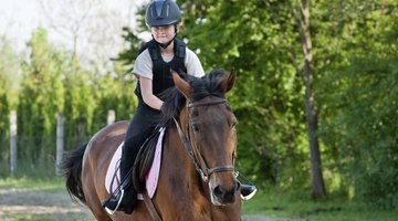 A girl is on horseback.