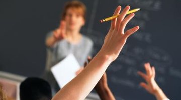 student raising his hand in class