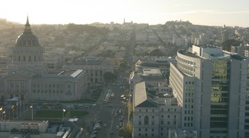 View west from the 24th floor James Edgar Hervey Skyroom at 100 McAllister Street. Visible buildings include San Francisco City Hall with its prominent dome, the city's Asian Art Museum of San Francisco at the left foreground and the Supreme Court of California on the right.