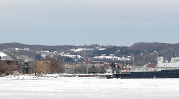 NMC's Great Lakes Campus, also showing the Great Lakes Maritime Academy's teaching vessel T/S State of Michigan.