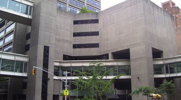 The West (seen here in the background) and East Buildings were constructed in 1981-86 – held up by the city's fiscal crisis – and were designed in the Modernist style by Ulrich Franzen & Associates; skyways connect all the buildings