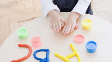 Kids can reinforce letters and numbers while using modeling clay, too.