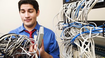 Student working tech in server room.