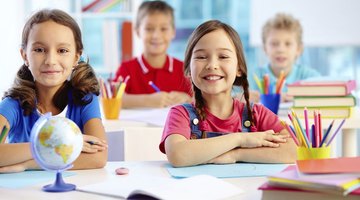 Happy preschool children in class.