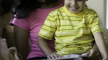 Reading to your preschooler can help to build his literacy skills.