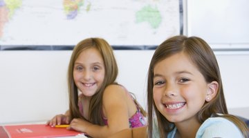 Smiling young students in classroom.
