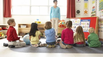 Students sitting with their teacher.