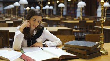 Student reading in library