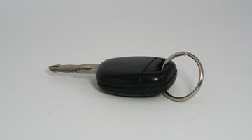 Car salesman holding keys