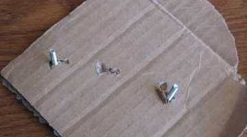 Attach the hardware and screws to cardboard.