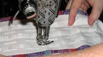 Sewing along the length of the heading tape