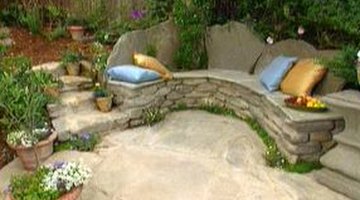 A stone bench blends with nature.