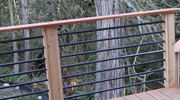 Metal bars fitted into a pre-drilled wood frame