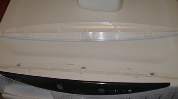 Remove screws connecting top control panel to front of washer.