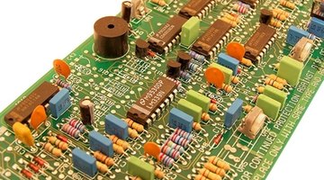 Wound inductor coils on circuit boards vary impedance based on frequency.