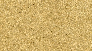 Sand the bar top three times with progressively finer grit paper.