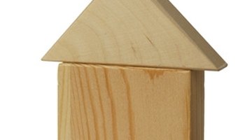 Trim a wooden wedge, so it fits into the foundation crack.