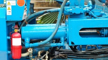 A hydraulic ram is used in conjuction with a hydraulic pump to shape and mold metal.