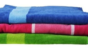 Absorbent towels remove excess moisture from wool garments.