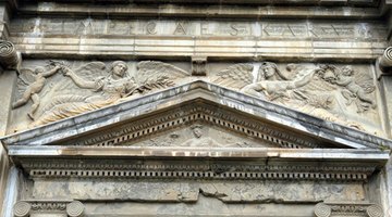 A pediment adorns a building's main entry.
