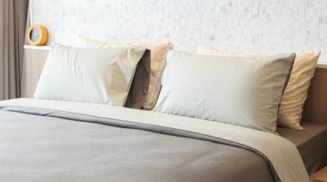 Choose a bedspread that reaches the floor to avoid the need for a bedspread.
