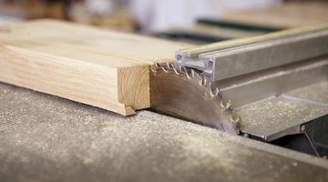 Circular saw cutting a piece of wood.