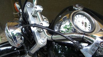 Reflection of motorcyclist in side mirror