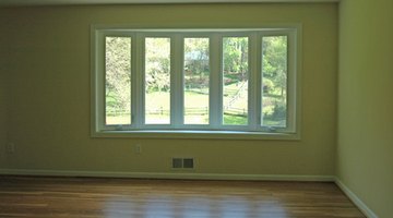 This soft ochre blends well with this room's wood floors.