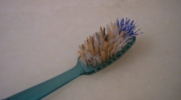 An old toothbrush comes in handy for removing stubborn stains.