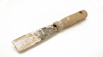 Use a putty knife to apply wood filler.